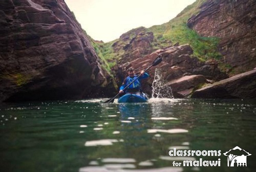 Kayaking through a canyon river